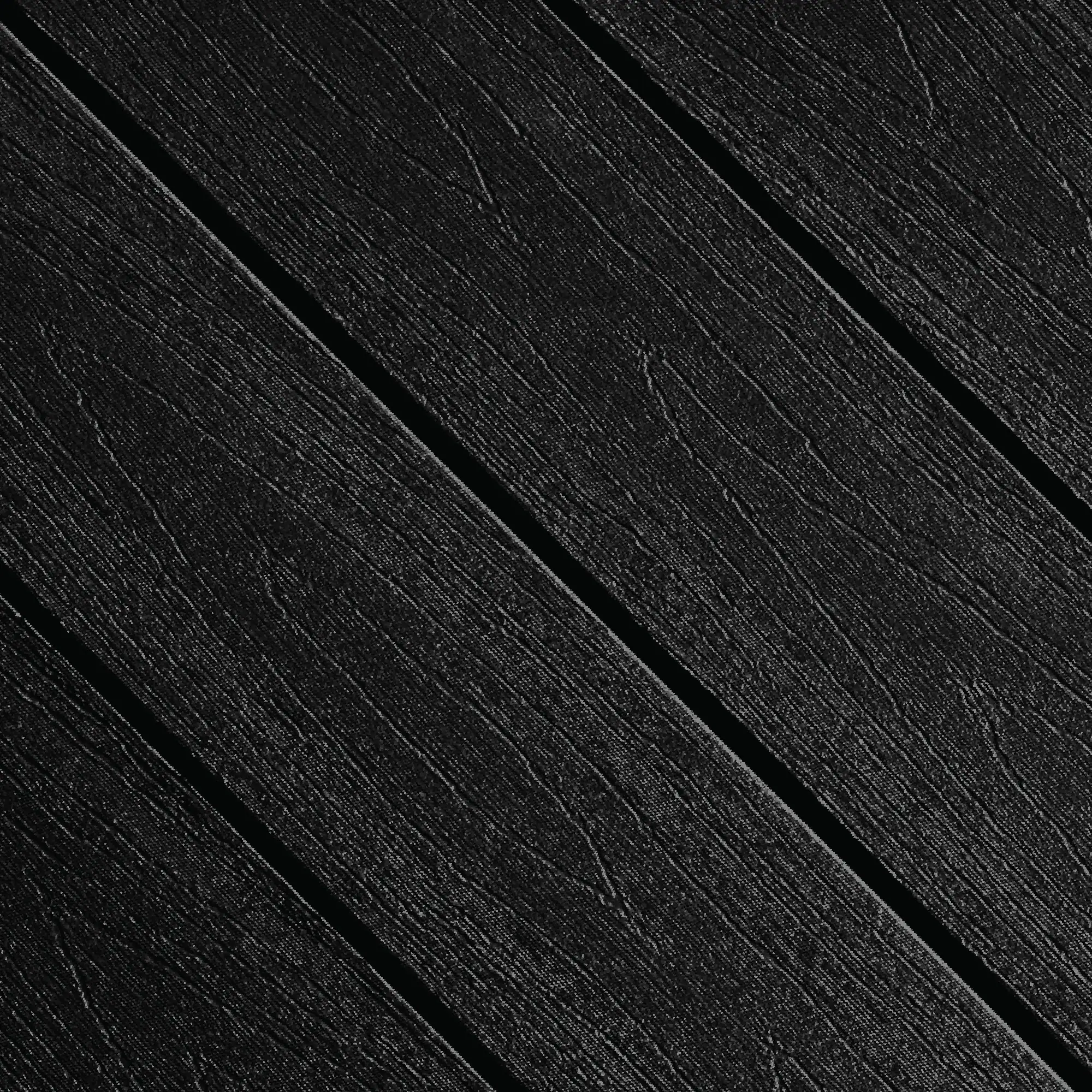 A close up view of TruNorth Decking boards in the colour Tuxedo Black