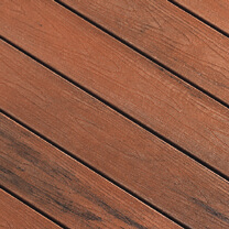 A close up view of TruNorth Decking boards in the colour Brazilian Cherry