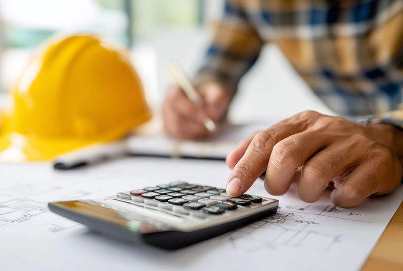 Deck cost calculator planning with contractor using calculator and building plans