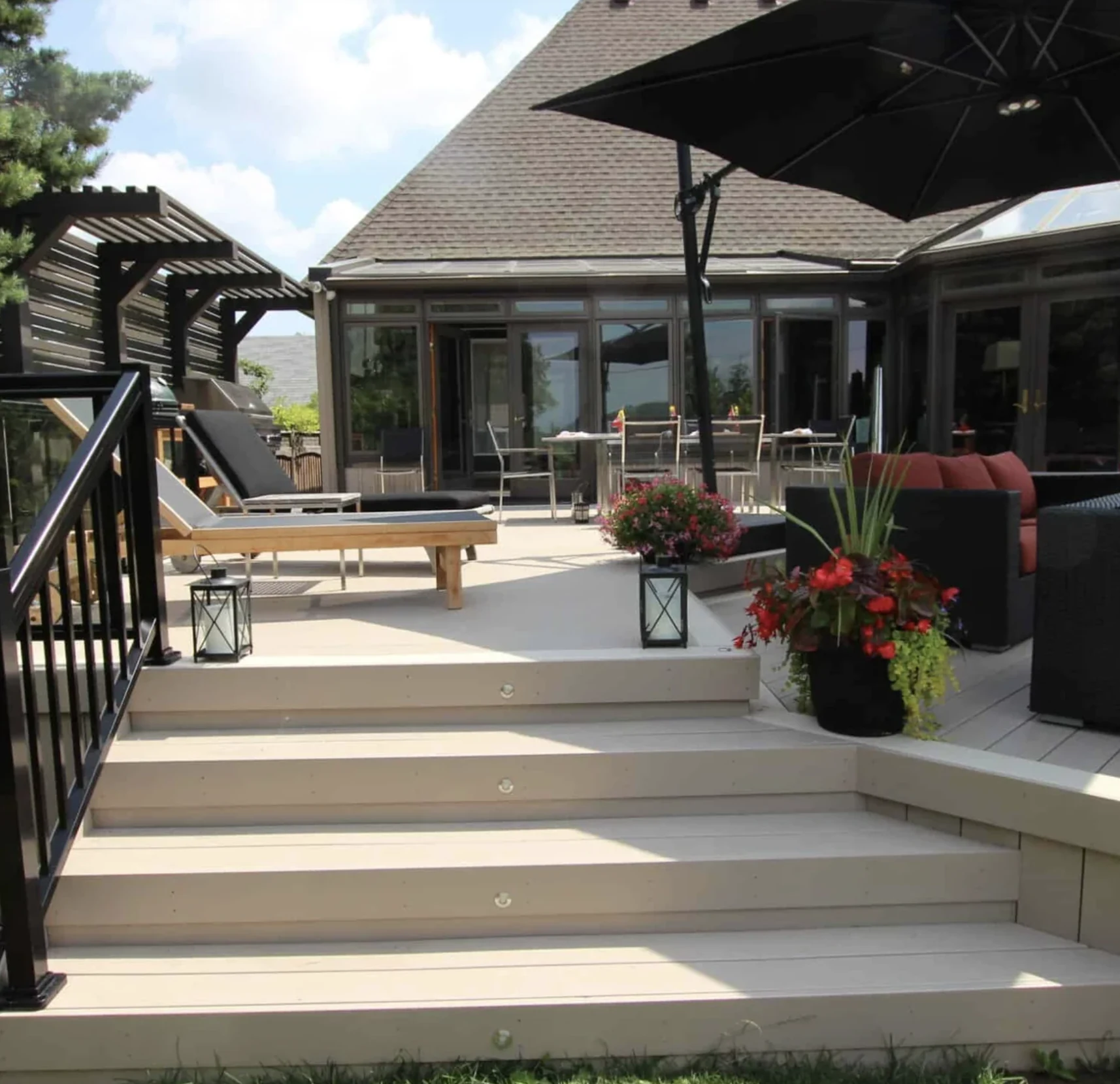 TruNorth Clubhouse Clay PVC deck with pergola, umbrellas and lounge chairs